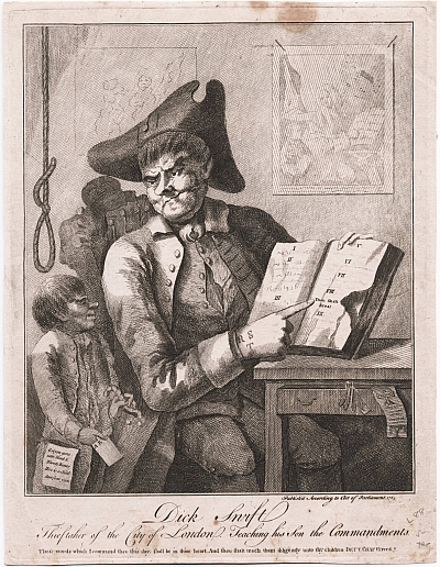 A man sits at a table pointing to an open book with Roman numerals down the middle of the page.  His face is scarred and on the back of his hand is a tattoo reading R S T.  by his side is a small child and above the child's head is a hangman's noose.