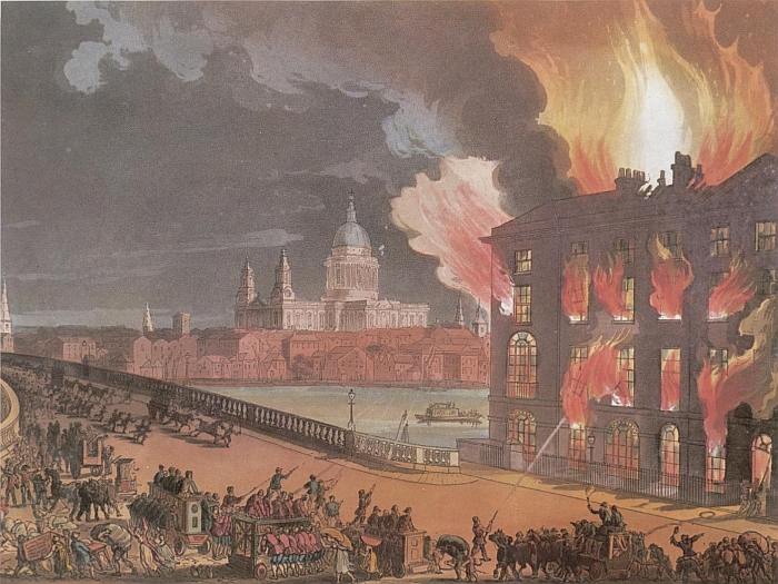 Fire billows from the windows of a large square building on the right of image, with firemen and pumping engines approaching it from the front.  Blackfriars Bridge stretches from in front of the burning building, north across the Thames, with St Paul's Cathedral on the horizon.