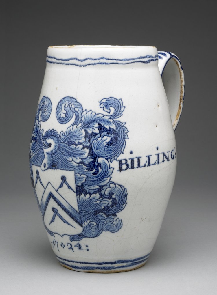 A large blue and white mug, painted with the arms of the Carpenters' Company of London, the name Thomas Billings, and a date, 1724