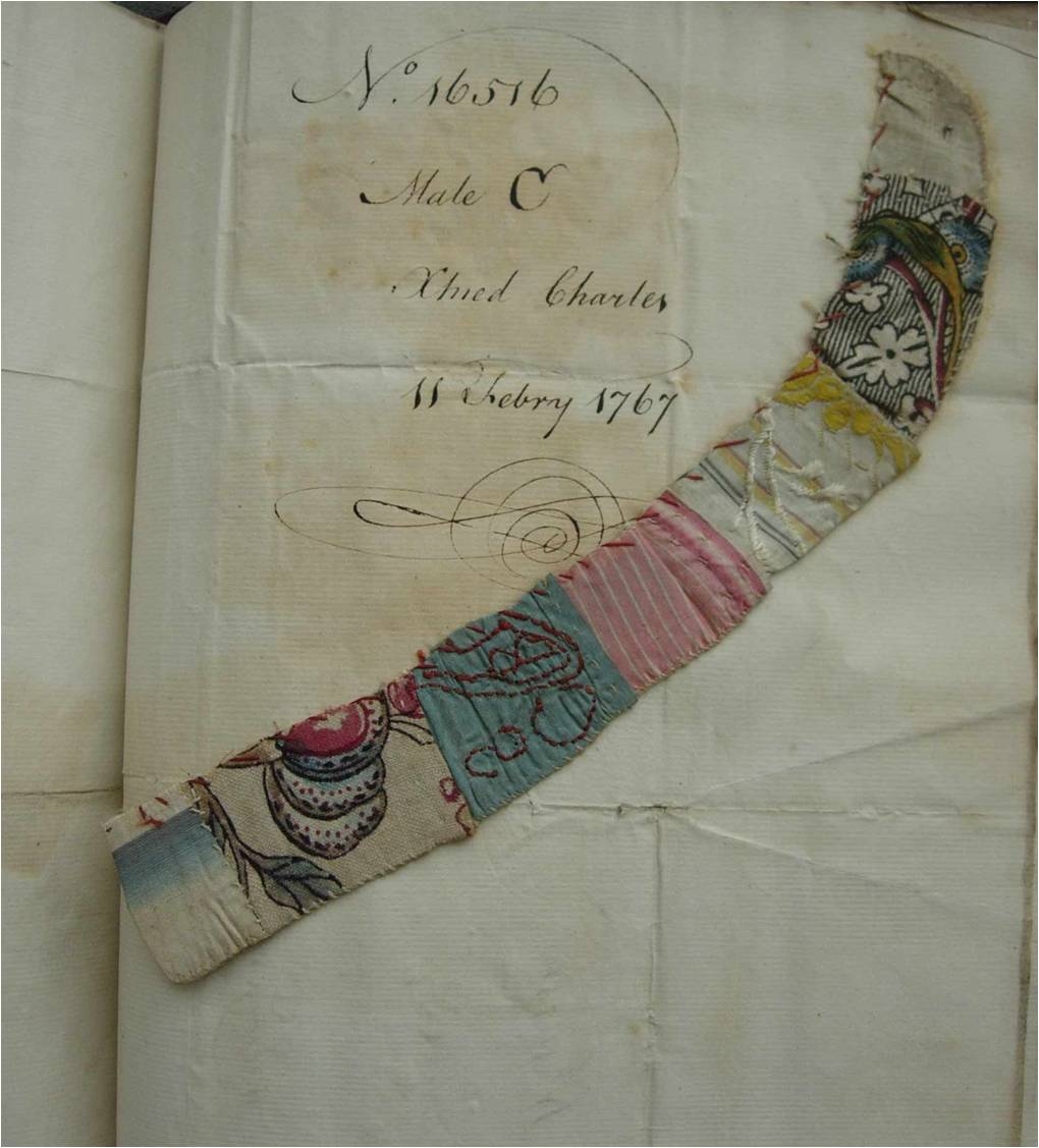 A strip of patchwork made from pieces of woven silk and printed cotton or linen, embroidered with a heart and cut in half, left at the Foundling Hospital, as an identifying token with a baby boy christened Charles on 11 February 1767