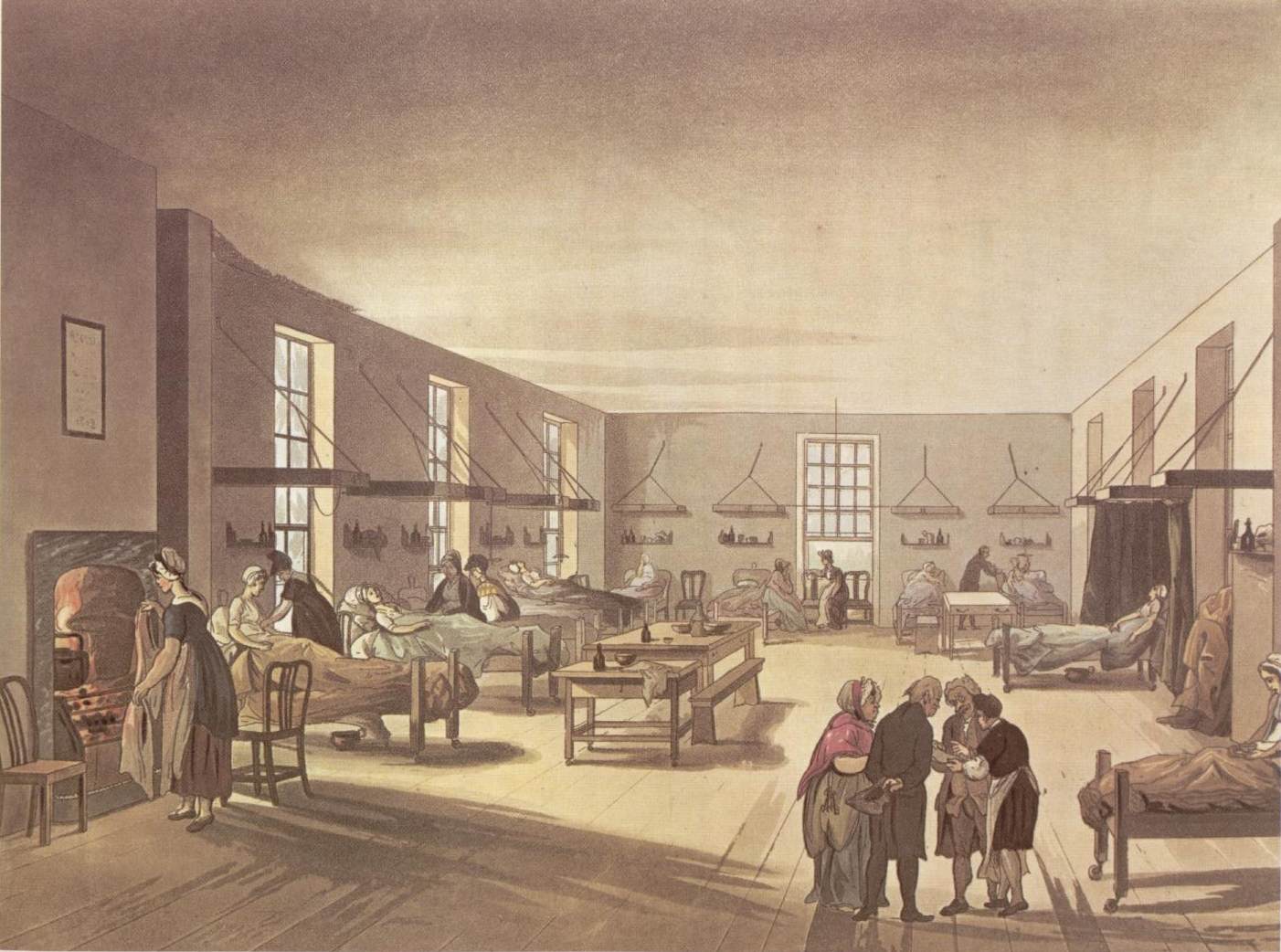 A scene on a woman's ward in a hospital.  Beds are distributed against the walls, with patients lying in most of them.  A group of two men and two men are consulting over papers in the foreground, and a further woman is standing before an open fire on the left.